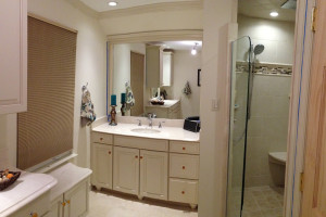 Removed tub & small shower to make His & Her vanities w/ large open shower.